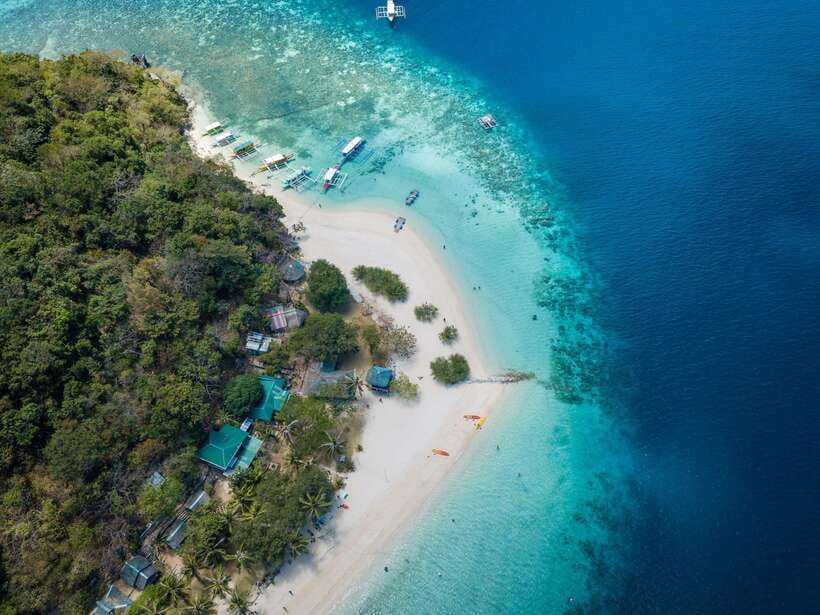 Coron: Coastal Cliffs, Beach & Malcapuya Island Hopping Tour - The banca boat ride: fun, but pack for sun and spray