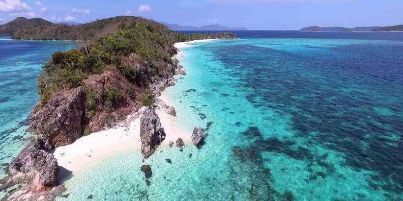 Coron: Coastal Cliffs, Beach & Malcapuya Island Hopping Tour - Stop 1: Banana Island for sand time, hammocks, and simple beach views