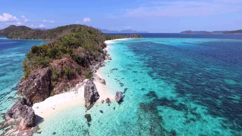 Coron: Coastal Cliffs, Beach & Malcapuya Island Hopping Tour - Getting to the boat: downtown pickup and timing in real life