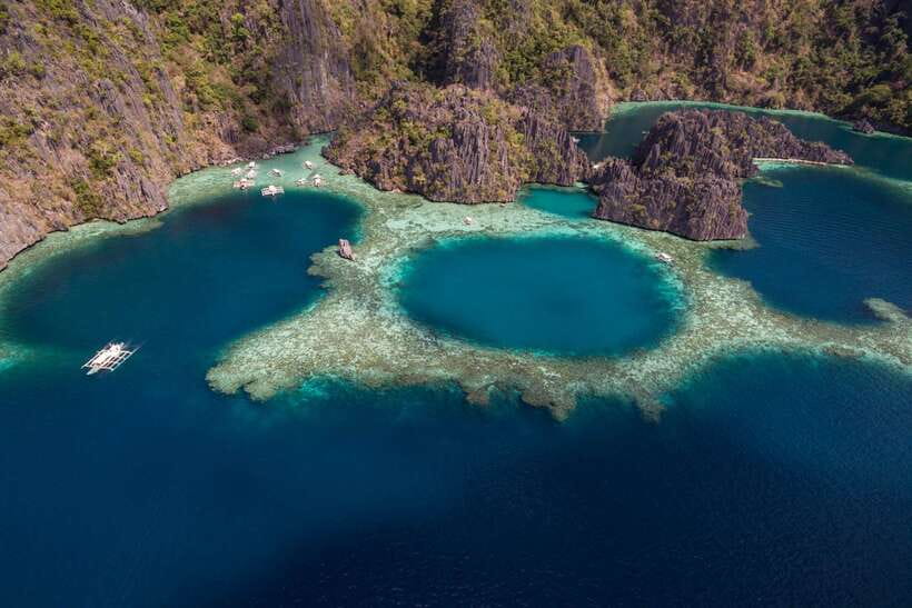 From Coron: Island Hopping Boat Day Trip with Buffet Lunch - Getting on the boat: pickup from Coron Town Proper