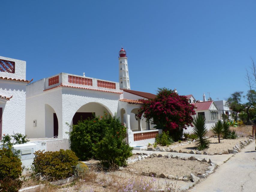 From Faro: 4 Stops, 3 Islands in Ria Formosa Catamaran Tour - Stop 2: Ilha do Farol for lighthouse photos and classic Algarve houses