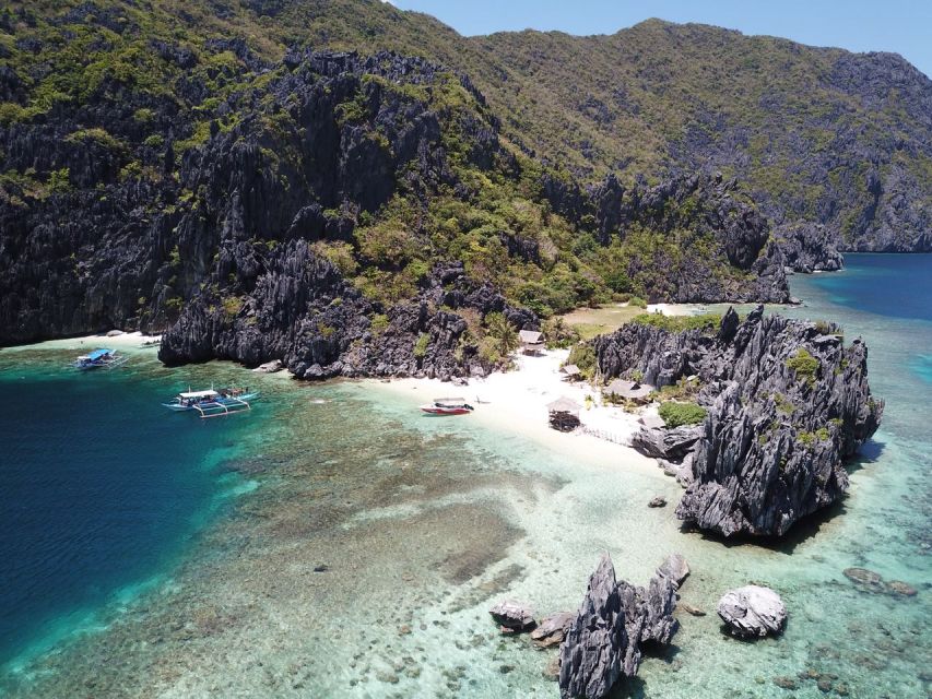 Half-Day Seasation Premium Speedboat Group Island Hopping - Hidden Beach and Seven Commandos: short shore time, big cliff energy