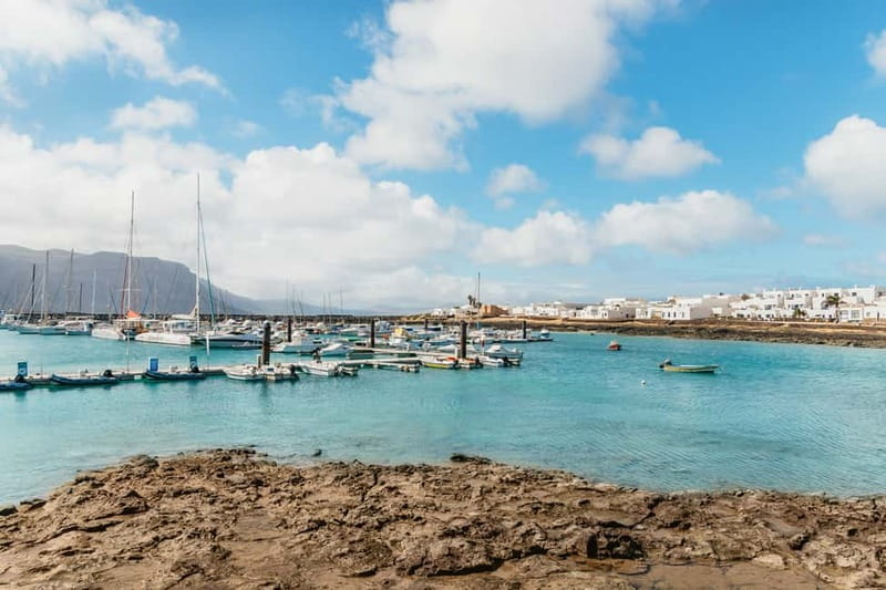 La Graciosa: Island Cruise with Lunch and Water Activities - Lunch and drinks onboard: paella, fruit, mojito, and unlimited bar